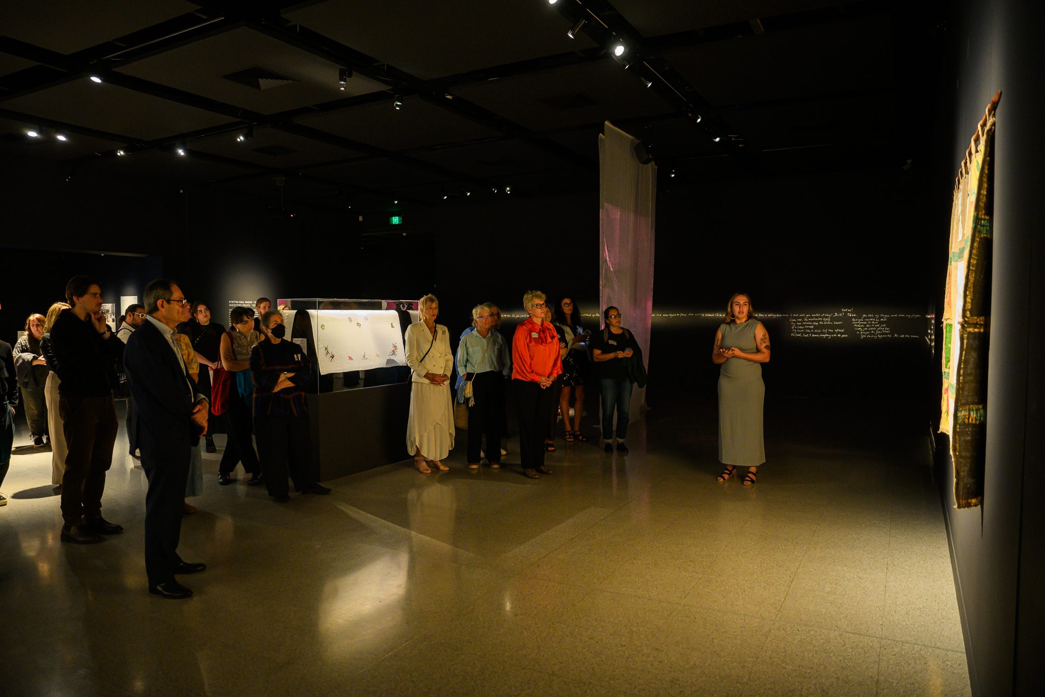 Curator Zali Morgan at John Curtin Gallery speaking to an audience.