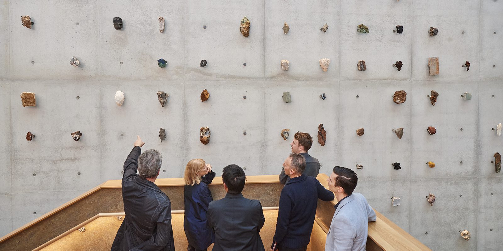 Janet Laurence CLIFF, 2022, Western Australian rocks, steel claws, painted typography. Curtin University Art Collection. Located inside B418 School of Design and Built Environment. Photographer: Frances Andrijich