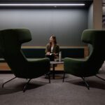 Student sitting on a seat with a water bottle