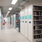 Image of the library compactus with books on the shelves.