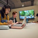 Students sitting together in a study space in TL Robertson Library