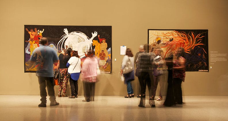People looking at artwork in gallery