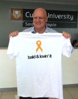 Professor Mienczakowski proudly showing off his shaven head and Go Bald T-shirt. 