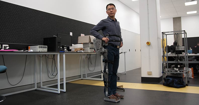 Dr Lei Cui wearing his leg exoskeleton.