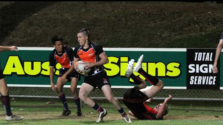 Isaiah Attkins playing rugby.