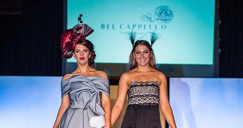 Holly Kiely and Jesica McKenzie stand together on the runway after their May show.