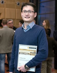 Dr Wensu Chen posing with certificate