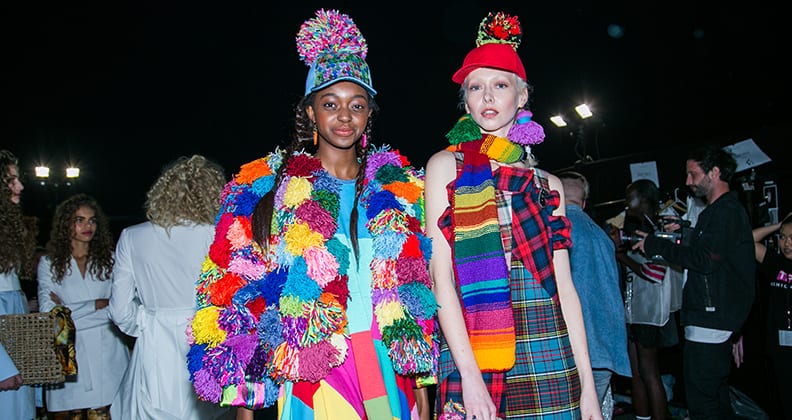 Two models wearing clothing from Kate Hannah's colourful P'JUNK collection.