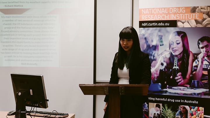 Dr Lam giving a presentation.