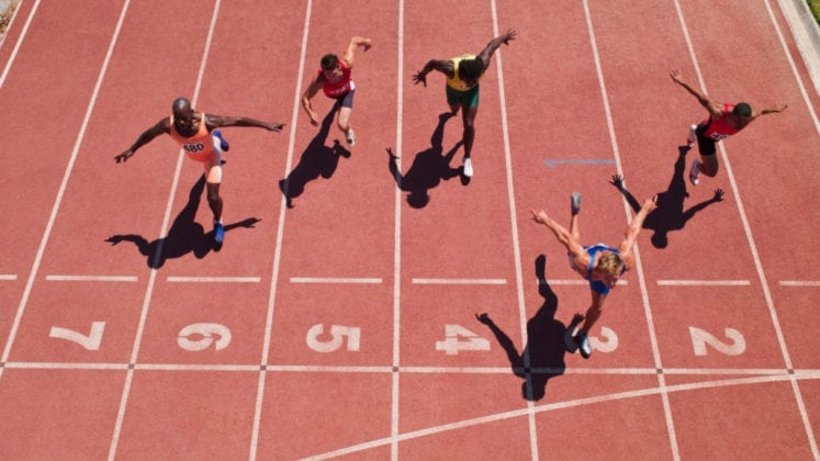 View of runners crossing finish line from above.