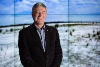 Professor Peter Newman with screen in background