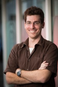 Ryan Urquhart standing with arms folded