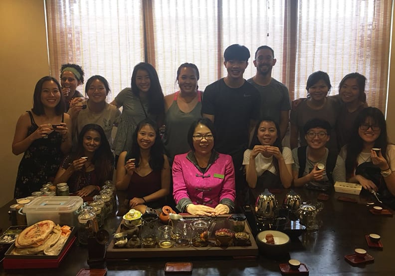 Students enjoying Shanghai food and drink.