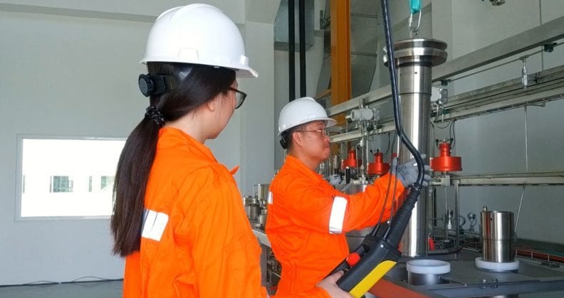 Staff using SFE equipment in the lab.