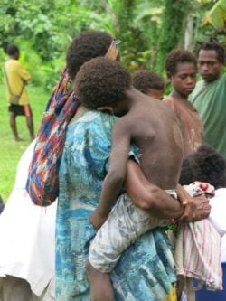 Child being carried in PNG.