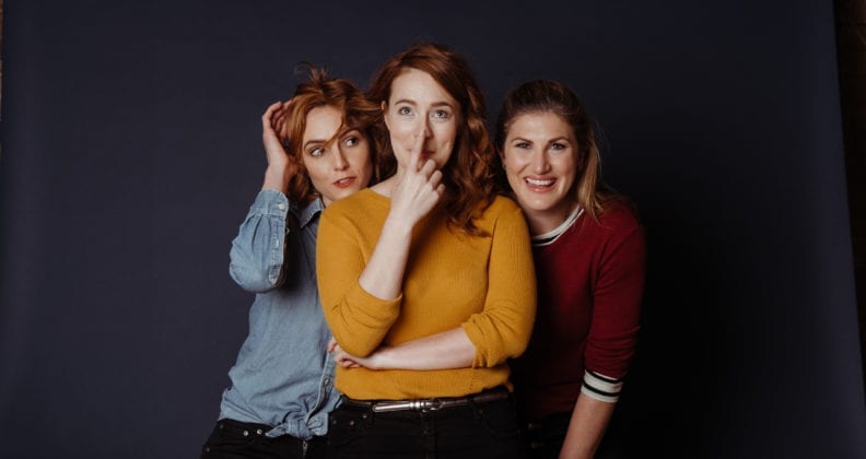 Ainslie Clouston, Grace Rouvray and Bec Bignell pose against a black backdrop.