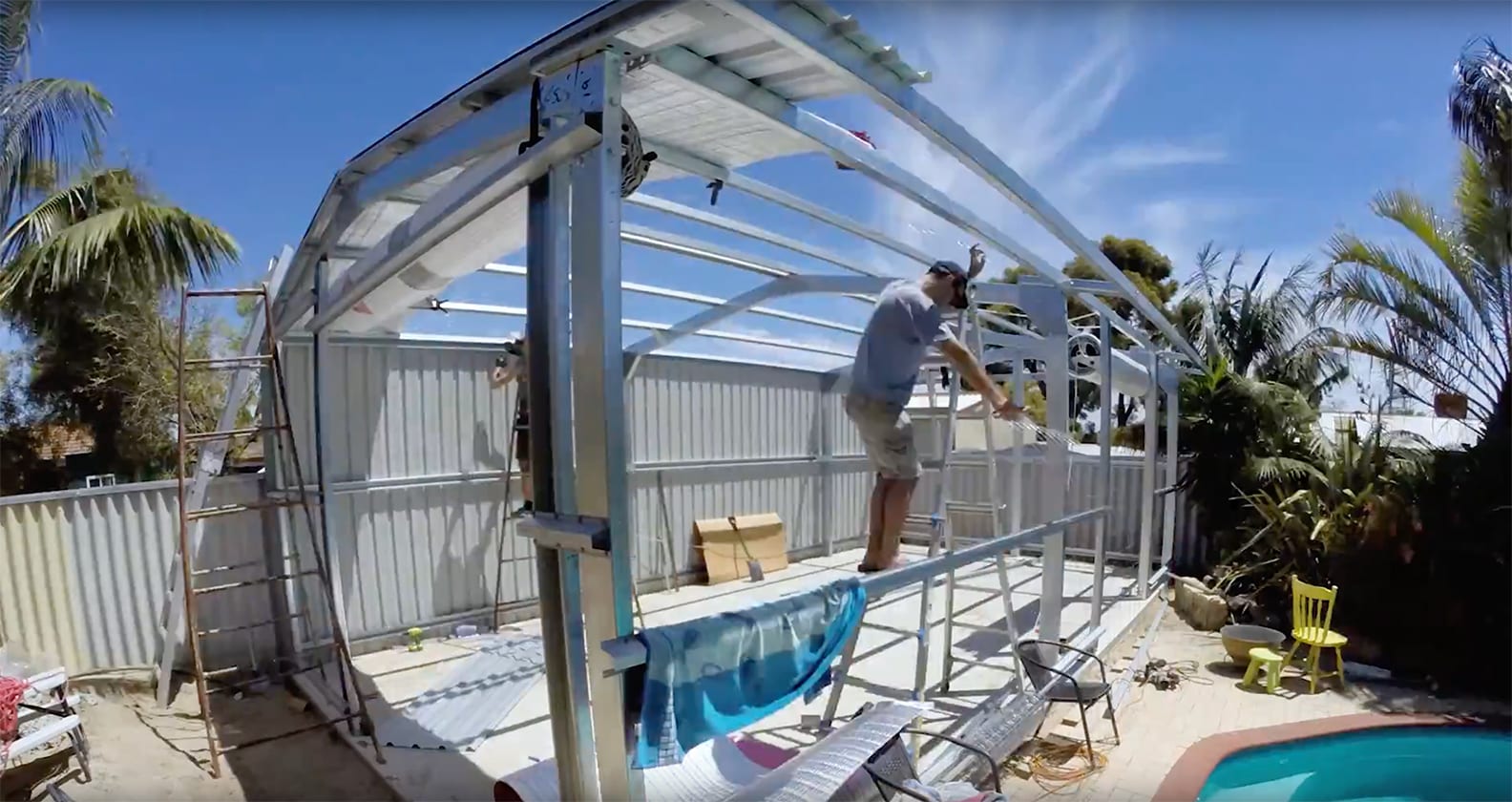 Worker working at a backyard shed