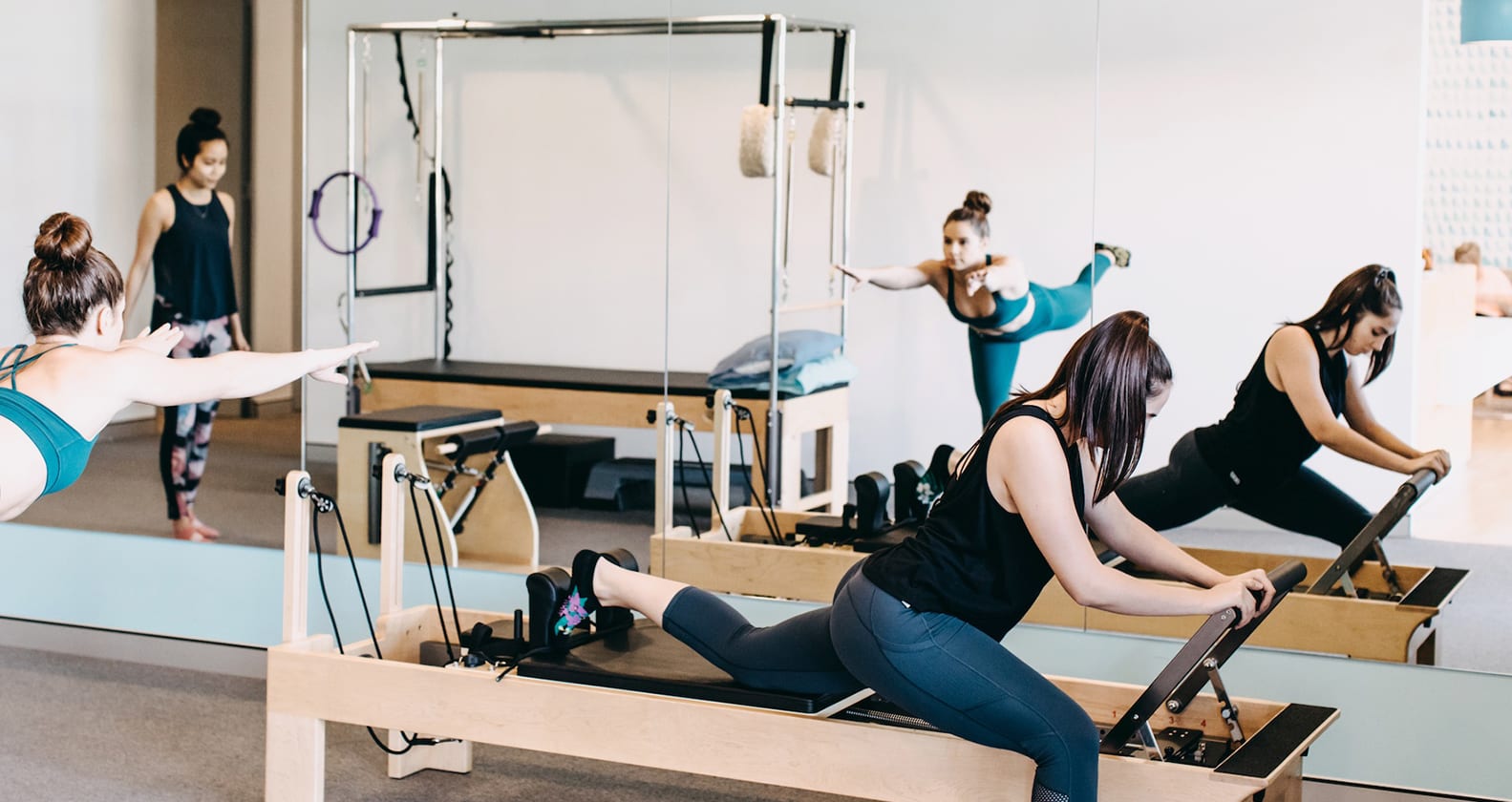 Two women doing pilates in a Life Ready studio.