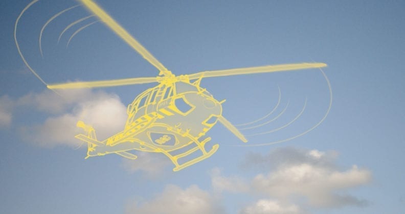 Yellow RAC helicopter illustration against a cloudy blue sky.