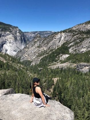 Girl sitting at lookout at Yosemite