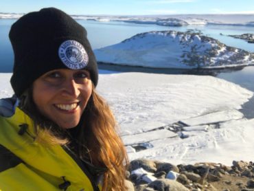 Curtin grad Briege wearing beanie in Antarctica