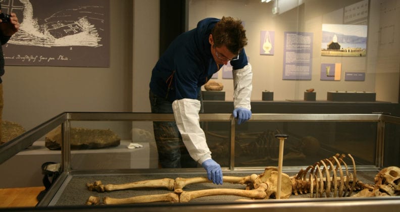 Allentoft prepares to sample a Viking skeleton at a museum on Faroe Islands.