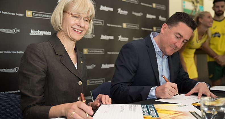 Vice Chancellor Professor Deborah Terry and Hockey Australia Cheif Executive Cam Vale signing the partnership agreement at Curtin University