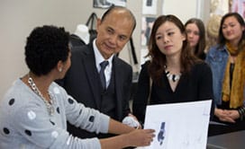 Mallory Maduka-Ike showing Professor Choo and Illiza Ho her drawings