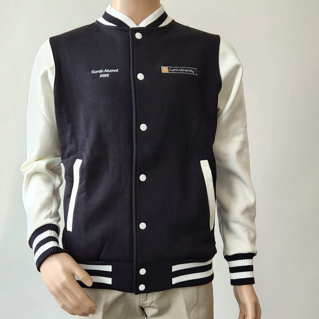 A varsity jacket with white arms, black and white striped hem and black body fabric.