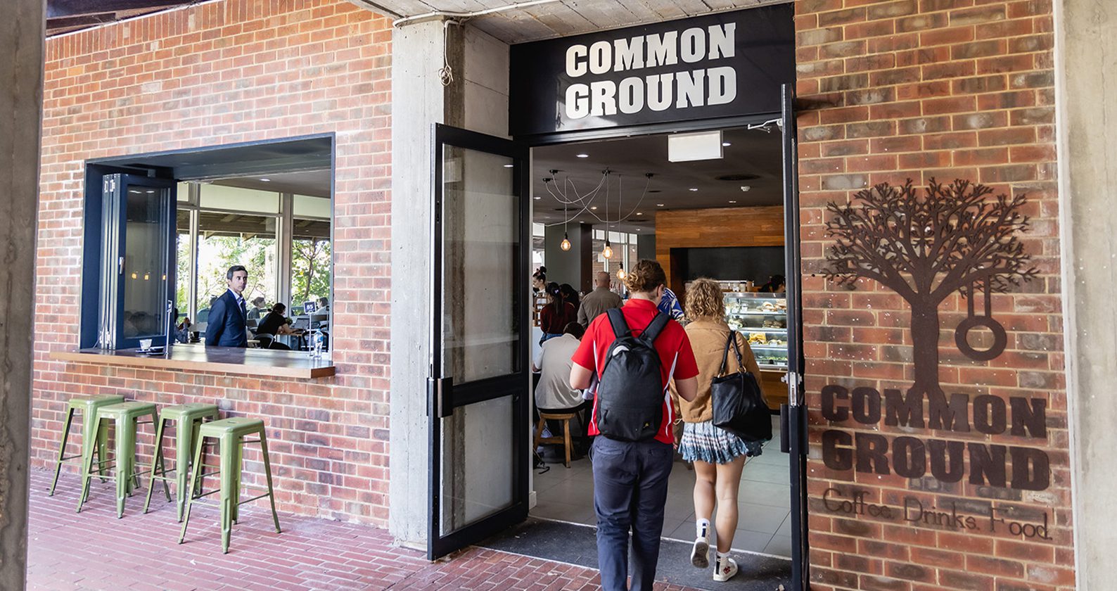 Students walking into Common Ground cafe