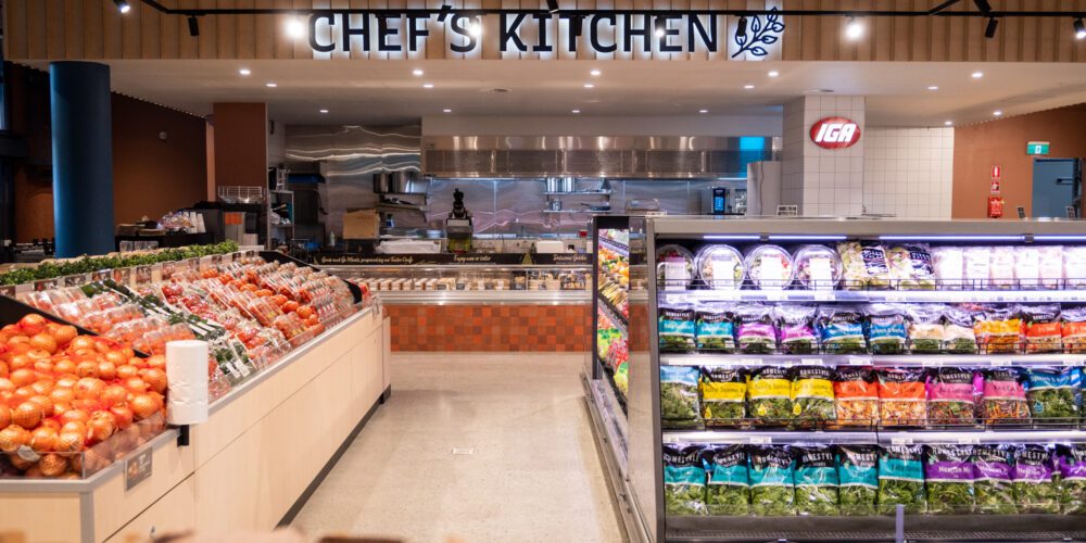 Photo of new tucker fresh IGA with text that reads "chef's kitchen".