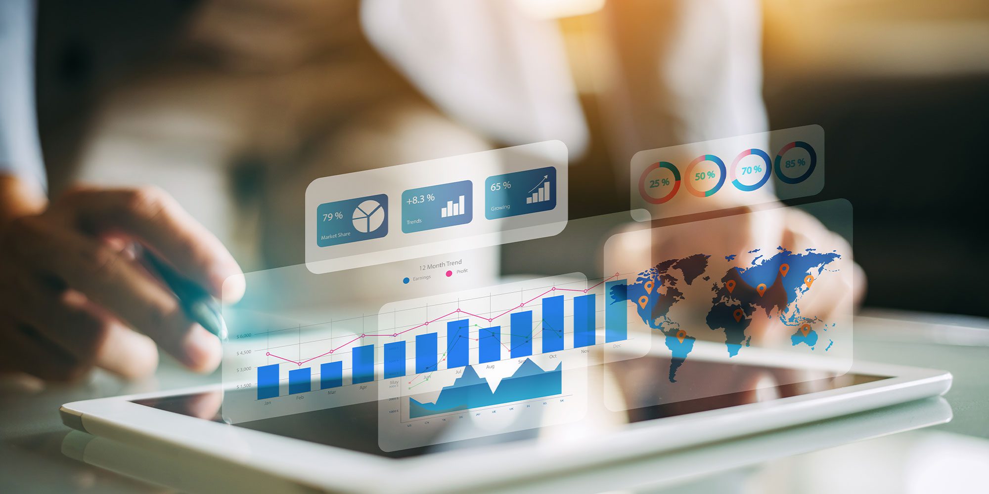 Hand holding a pen over a tablet with several images superimposed of different graphs and charts.