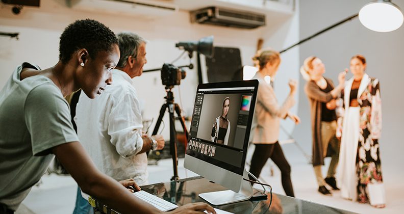 Art director checking photos on a monitor.