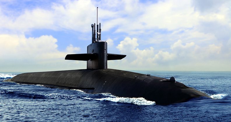 Naval submarine on open blue sea surface.