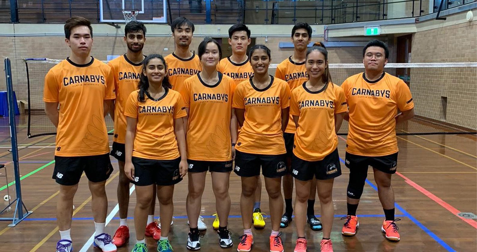 Group of students wearing Curtin Carnabys orange t-shirts