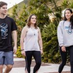 Three students outside the Curtin gym