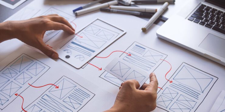 A UX graphic designer creative sketch planning application process.
