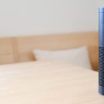 Amazon Alexa device on a wooden table.