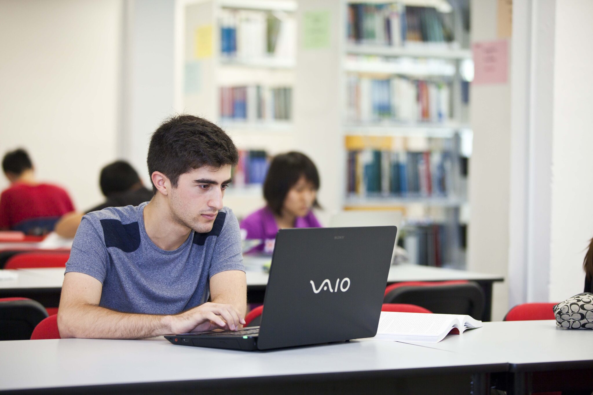 Student working on a laptop.