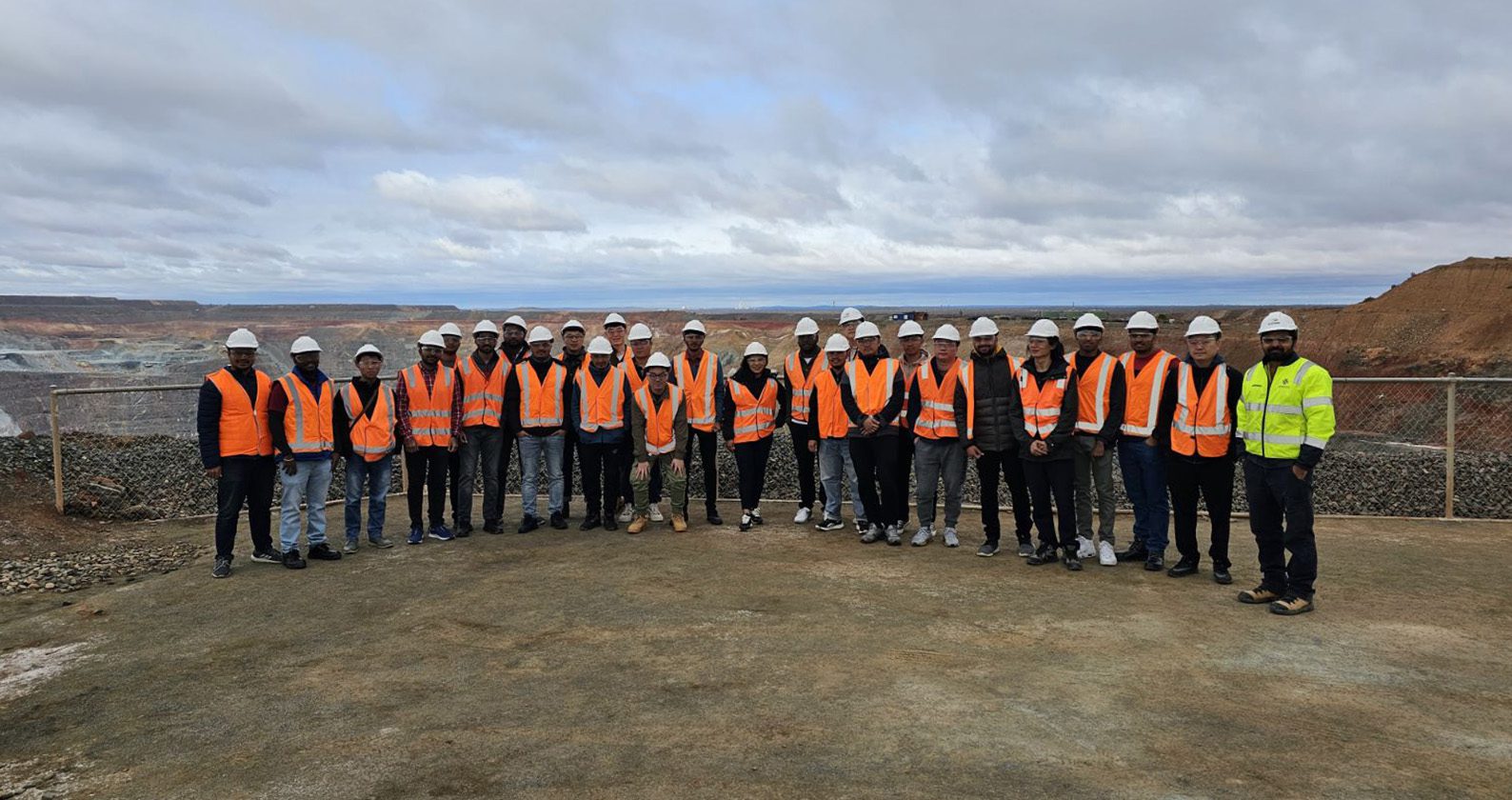 The new semester 2 2023 cohort in front of the Kalgoorlie Super Pit.