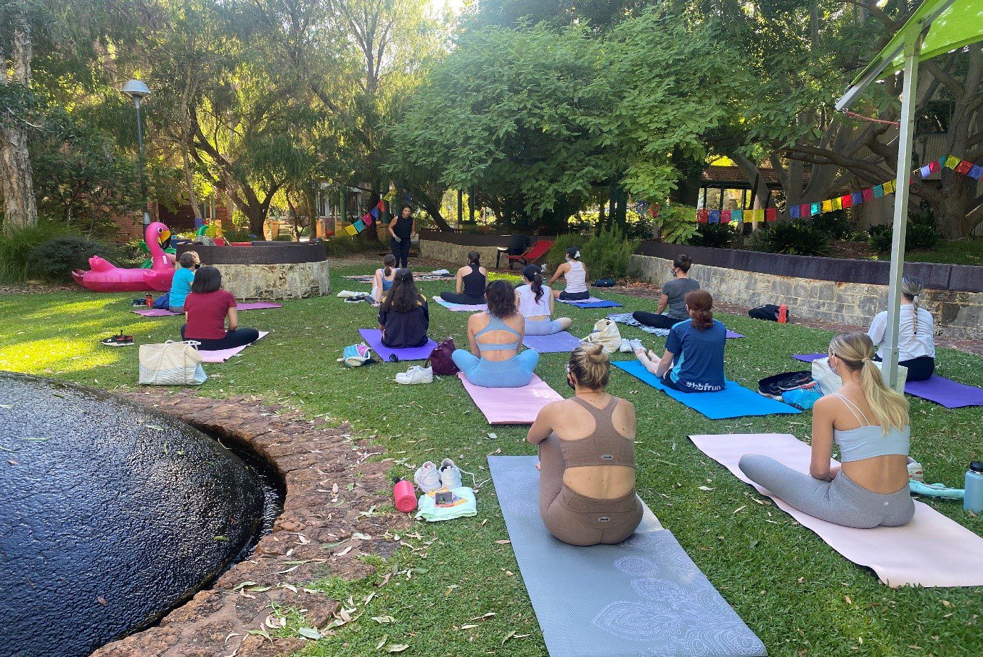 Students attending an outdoor yoga class.