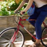 Student riding a bike on campus.