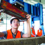 Student working with construction equipment.