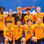 A group of University students and Curtin Carnaby UniSports representatives stand and kneel for a photo.