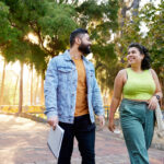 Two students walking through campus