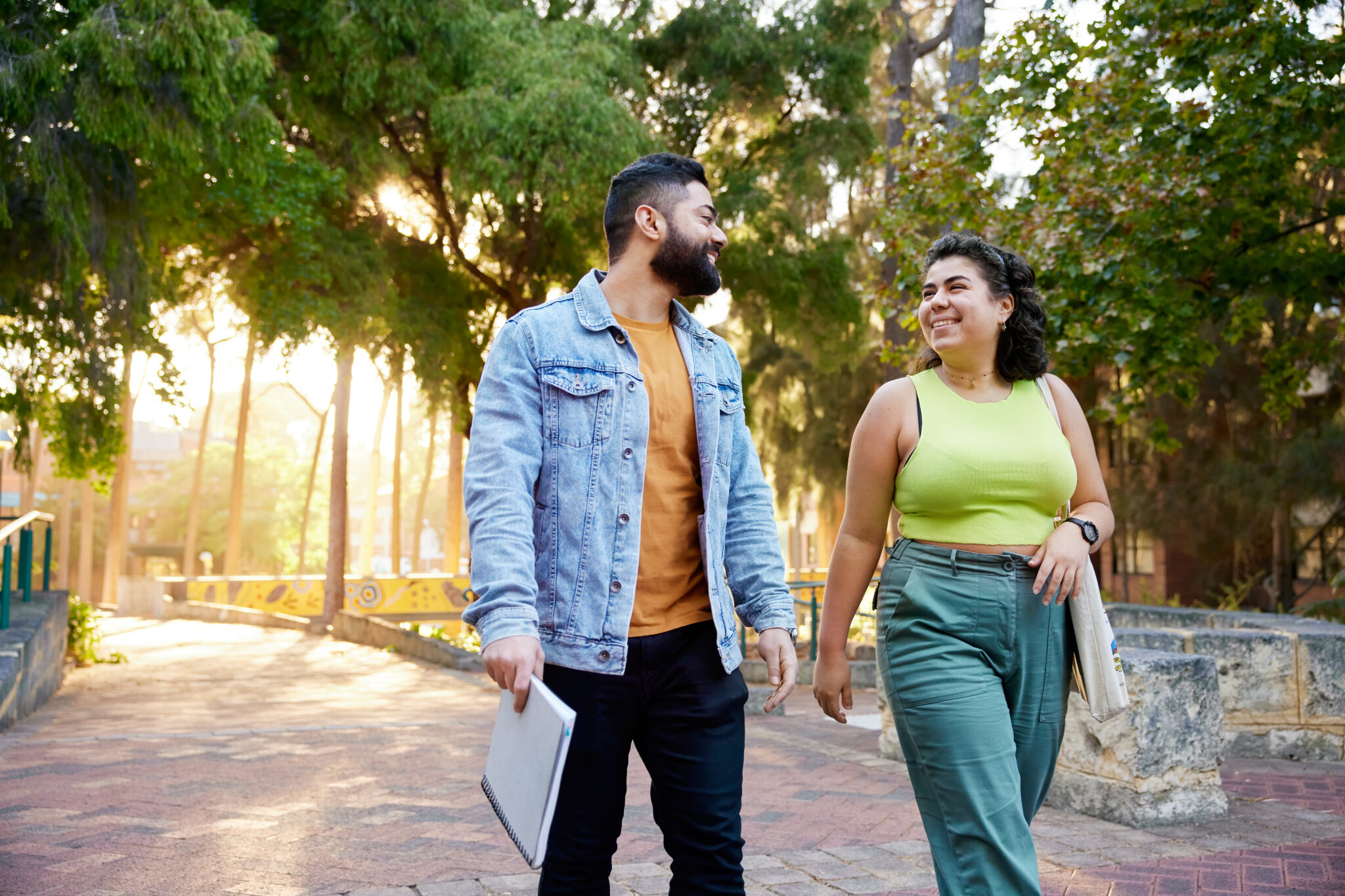 Two students walking through campus