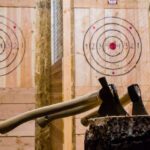 International students try axe-throwing at Lumber Punks