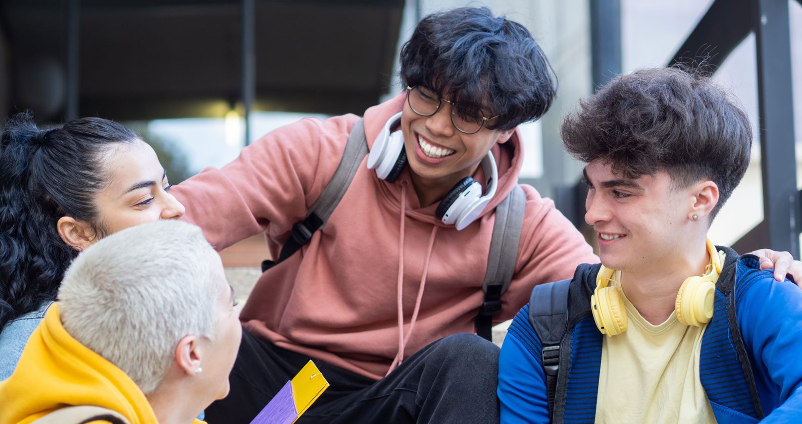 Students conversing and laughing.
