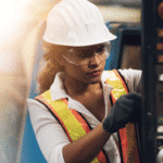 Woman wearing hard hat and high vis
