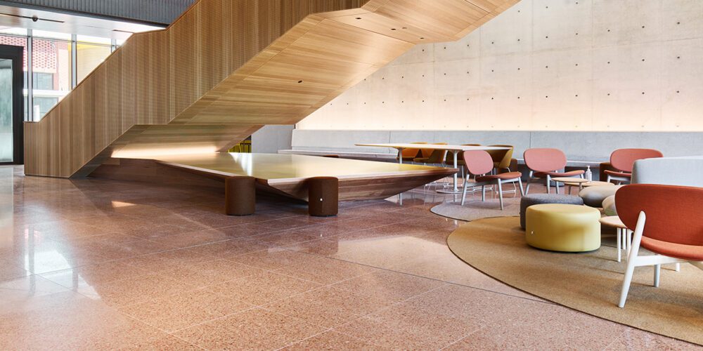 A relaxing study space inside the Design and Built Environment building at Curtin Perth showing the use of natural materials such as wood, and natural light.